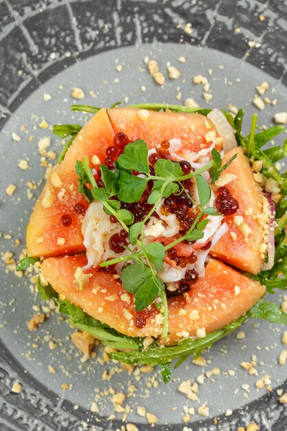 Citrus green salad with salmon, grapefruit and avocado.