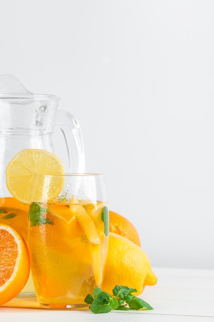 Citrus lemonade, summer drink on white background