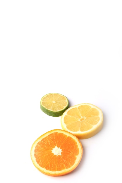 Citrus orange lemon lime cut circles isolated on white background