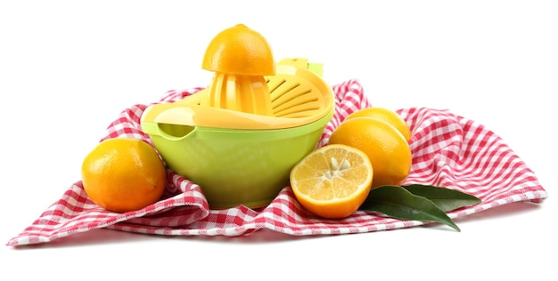 Citrus press and lemons isolated on white