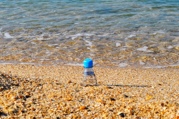 The city of baku the coast of the caspian sea the last days of\
summer the end of the beach a bottle of sparkling water in the\
squeak of shells