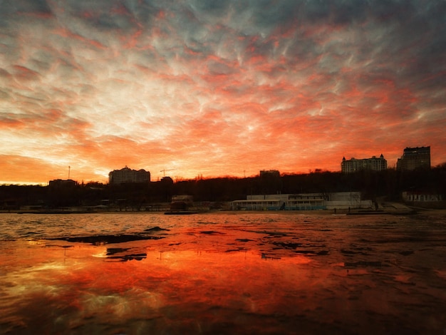 The city beach on the background of the sunset Illustration