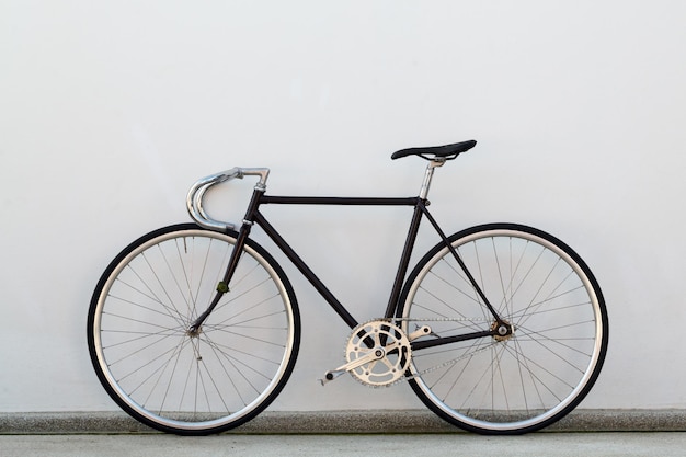 City bicycle fixed gear and concrete wall