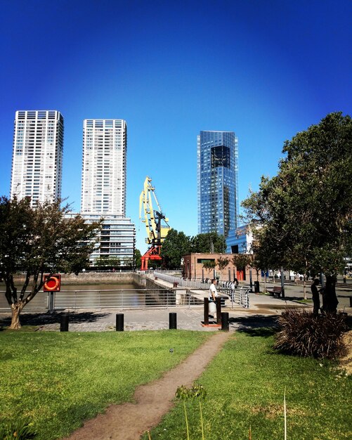 City buildings against clear blue sky