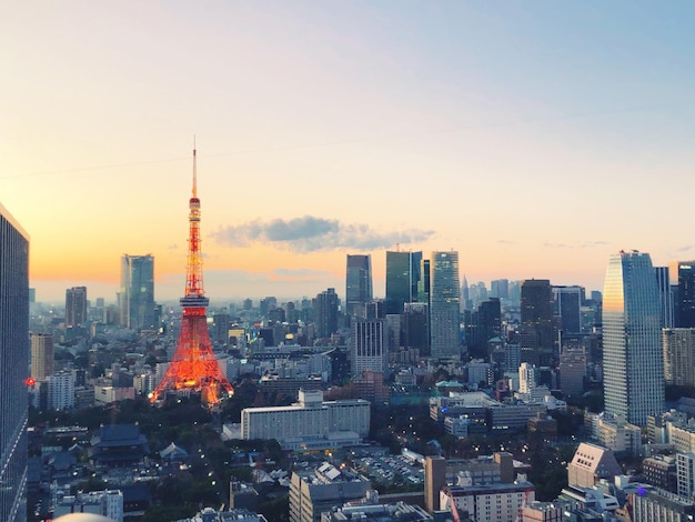 Photo city buildings against sky during sunset