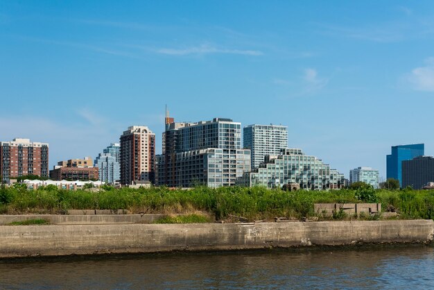 City by river against sky