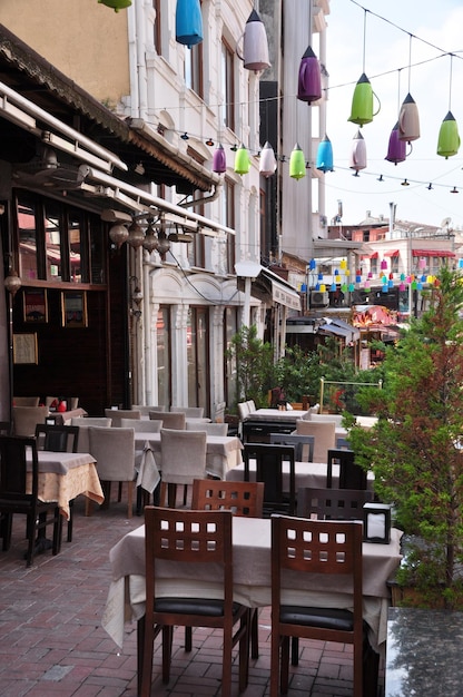 City cafe in Istanbul. Tables are covered with white tablecloths .. 07 July 2021, Istanbul, Turkey.