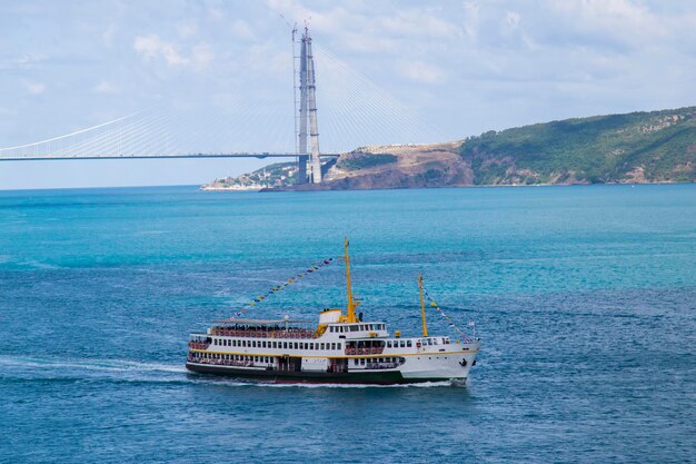 City ferry of Istanbul during the Bosphorus Tour with background of third bridge of bosphorus