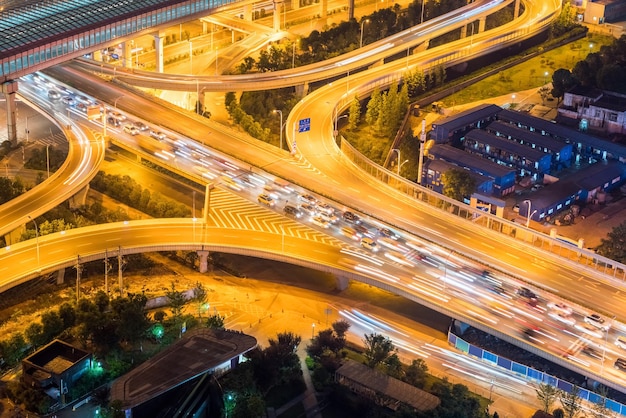 City interchange closeup at night on rush hour