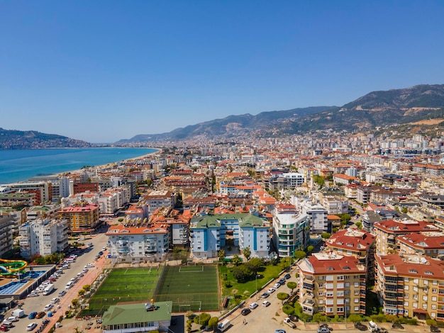 A city is seen from the top of a hill.