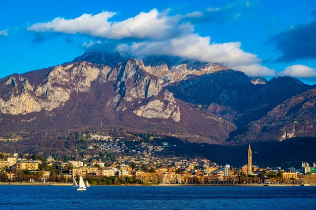 The city of lecco with its lakefront and its buildings photographed by day