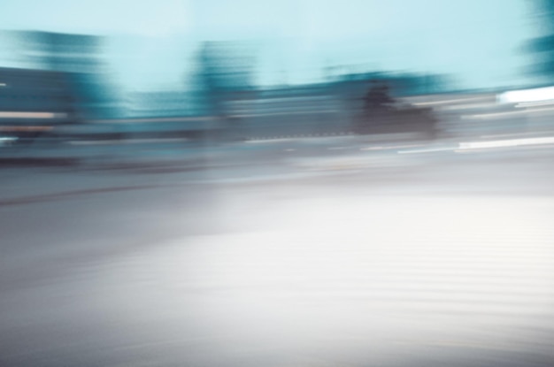 City lights and shiny snow Night winter blurred background Winter city street blur background