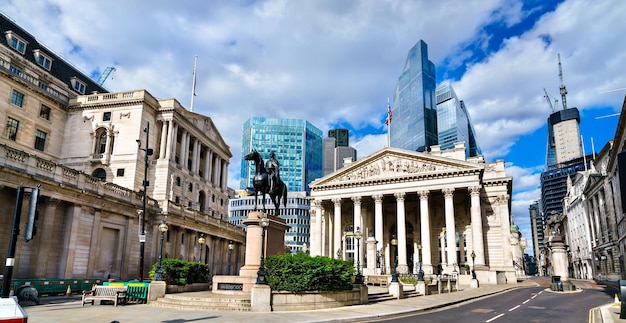 City of London with Royal Exchange and Wellington Statue at Bank Junction England UK