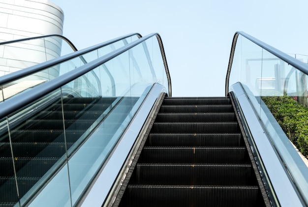 City outdoor escalator under the sun