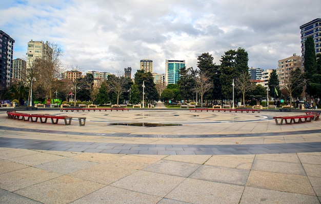 City park empty square trees city view under cloudy sky