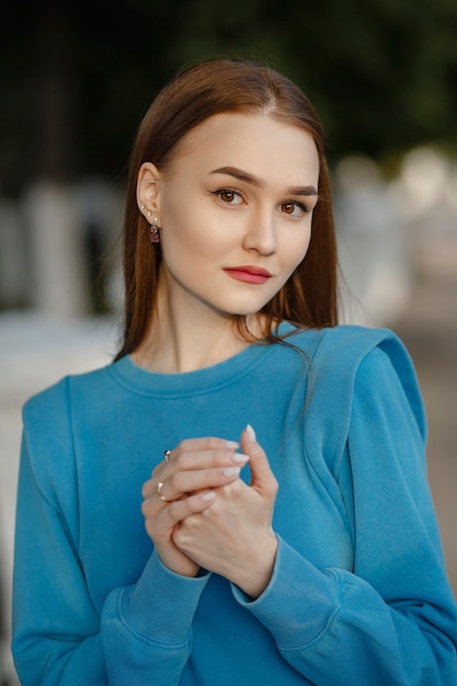 City portrait of a girl with a blue dress