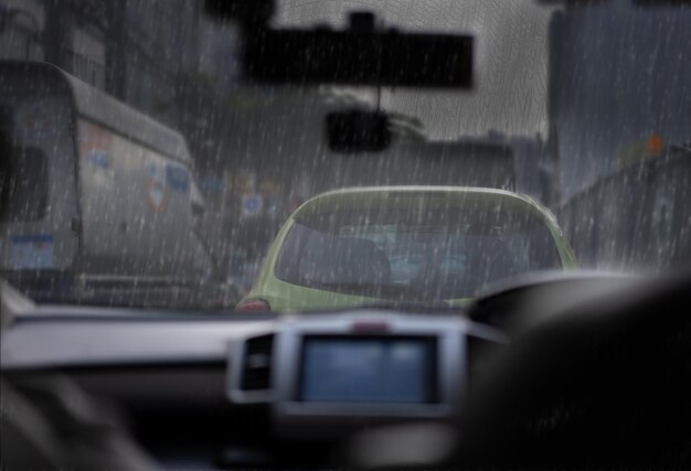 City rain view from inside car