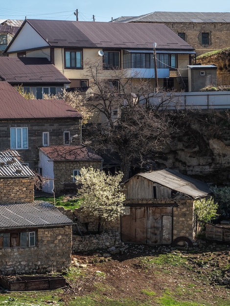 The city on the rock. Authentic Dagestani mountain village of Hunzah. A lot of houses built close to each other, closely. Russia.