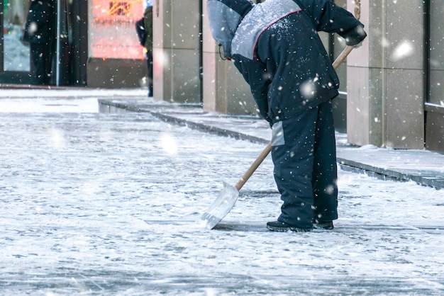 City service cleaning streets from snow with special tools after snowfall d