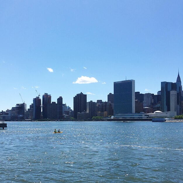 City skyline against blue sky