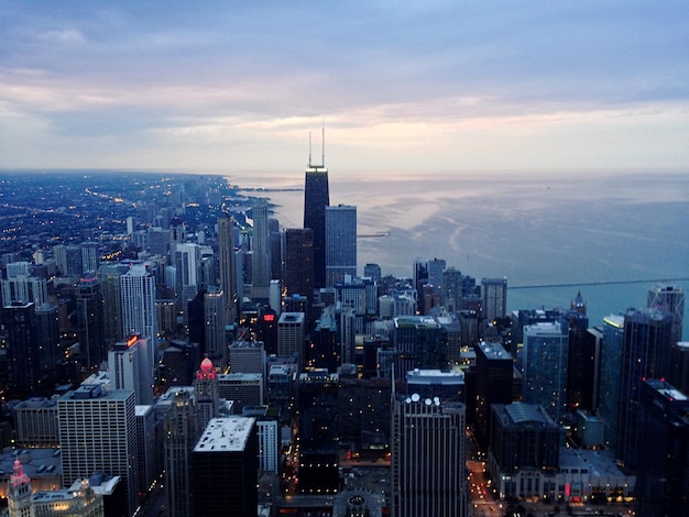 City skyline against cloudy sky