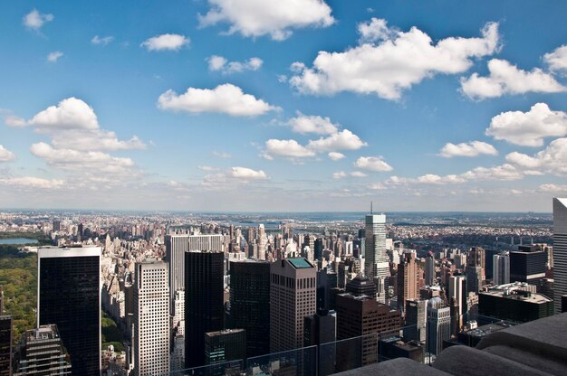 City skyline against cloudy sky