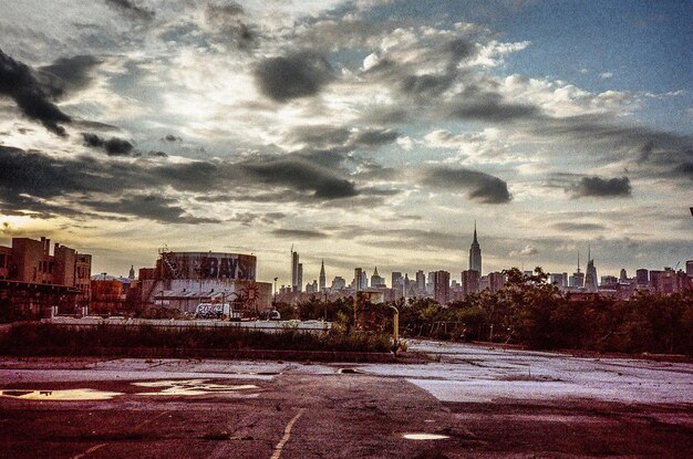 City skyline against cloudy sky