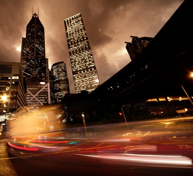 a city street with a car and a building in the background