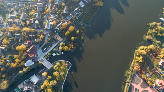 City traffic road with modern building top view from drone