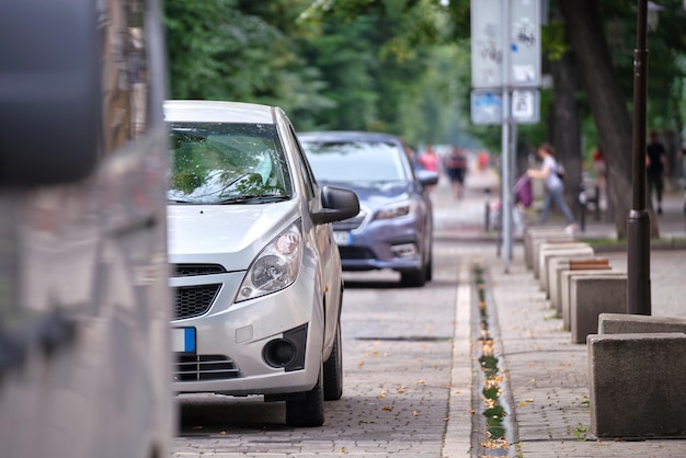 City traffic with cars parked in line on street side