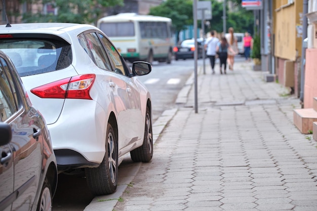 City traffic with cars parked in line on street side