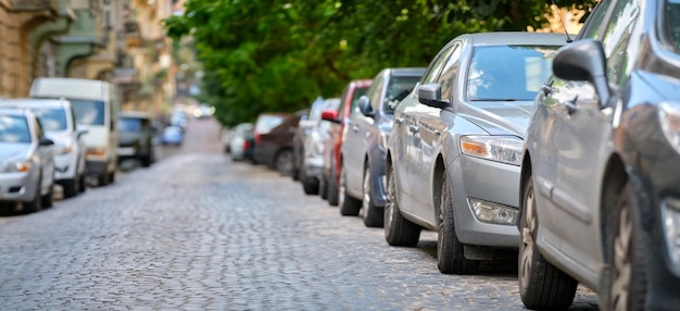 City traffic with cars parked in line on street side