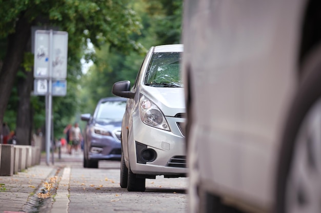 City traffic with cars parked in line on street side