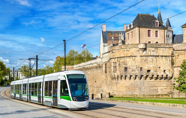 City tram at the Castle of the Dukes of Brittany in Nantes