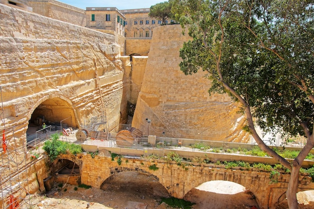 City wall at the entrance into Valletta old town in Malta