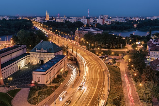 City of Warsaw by night in Poland, urban landscape of the capital city with traffic. Travel destination background