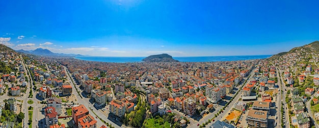 A city with a blue ocean in the background