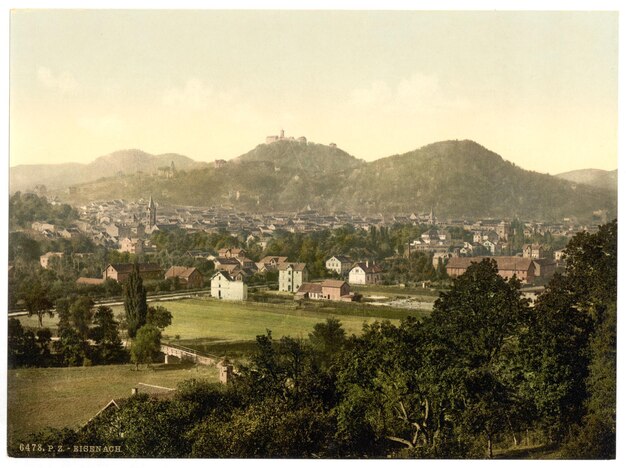 a city with a mountain in the background and a city in the background