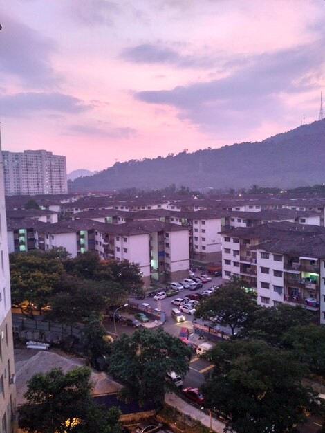 Cityscape against cloudy sky