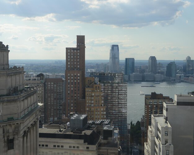 Cityscape against cloudy sky