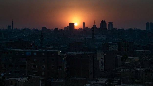 Photo cityscape against sky during sunset