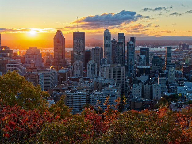 Photo cityscape against sky during sunset