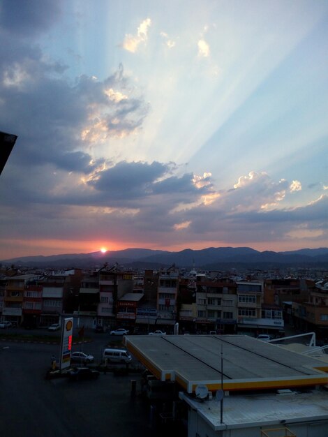 Photo cityscape against sky during sunset