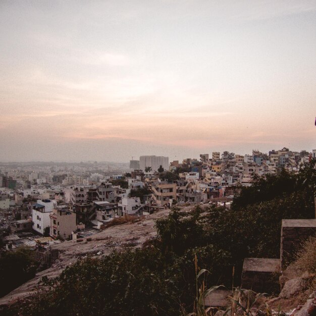 Photo cityscape against sky during sunset