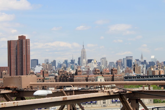 Cityscape against sky seen from manhattan bridge