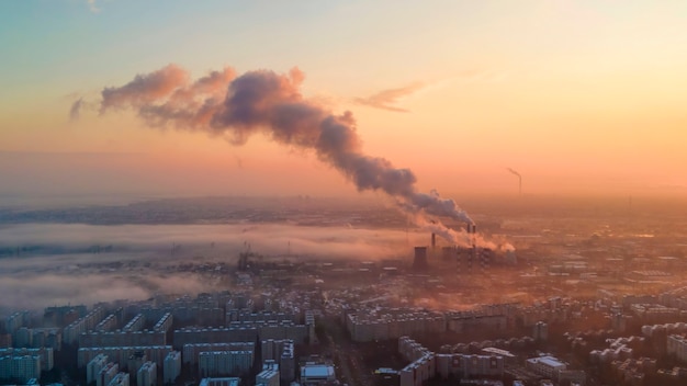 Cityscape of Bucharest from a drone, rows of residential buildings, thermal station with fog getting out and other the ground, ecology idea, Romania