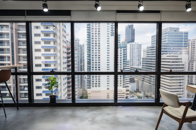 Cityscape of business office in downtown from empty coworking space temporarily closed at Bangkok