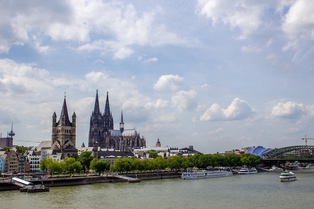 Cityscape of Cologne with Hohenzollern bridge cathedral Saint Martin church and Rin river in Germany