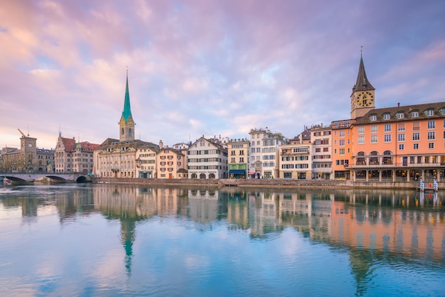 Cityscape of downtown Zurich in Switzerland during dramatic sunset.