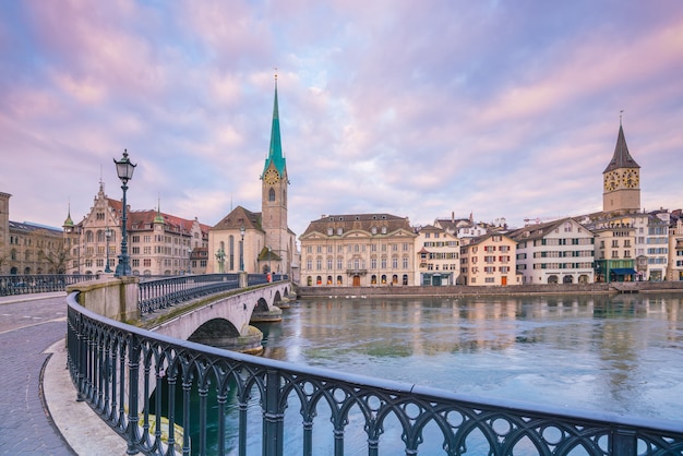 Cityscape of downtown Zurich in Switzerland during dramatic sunset.